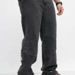 Jean baggi gris con cierre en bota